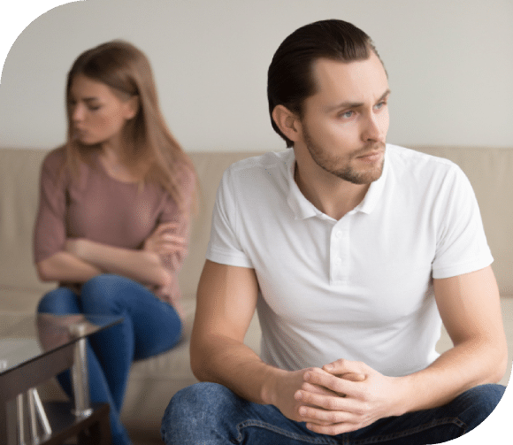 Divorcing couple in mediation session with lawyer